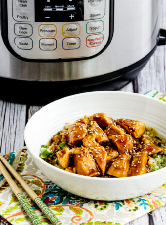 Instant Pot Teriyaki Chicken thumbnail image of chicken in rice bowl with Instant Pot in back
