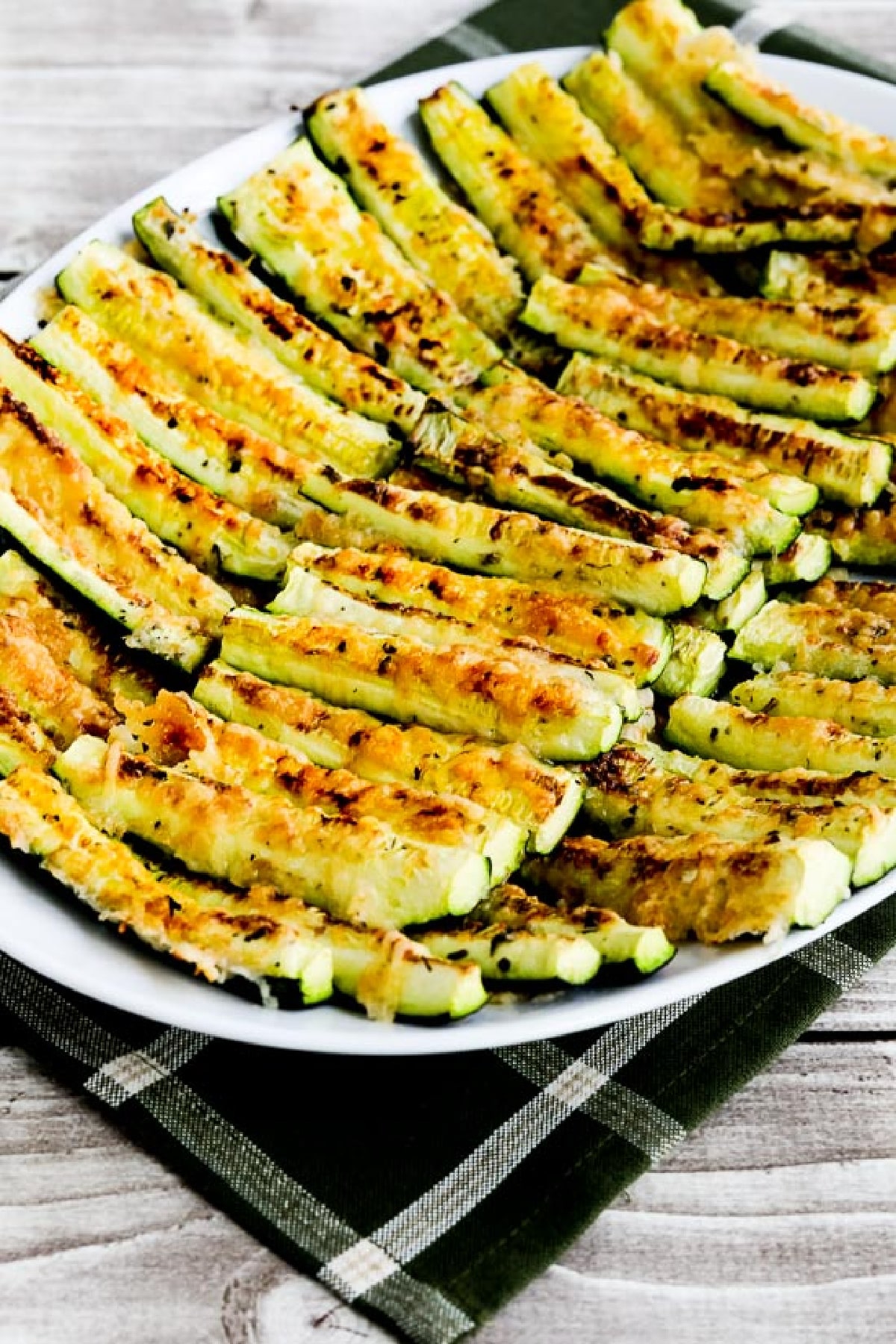 Parmesan Encrusted Zucchini on serving plate with napkin