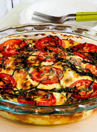square image of Crustless Three-Cheese Tomato-Basil Quiche in baking dish