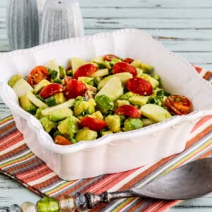 Heart of Palm Salad (with Tomato and Avocado) shown in serving bowl with fork.