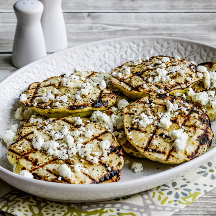 square thumbnail image for Grilled Patty Pan Squash in serving dish with crumbled goat cheese