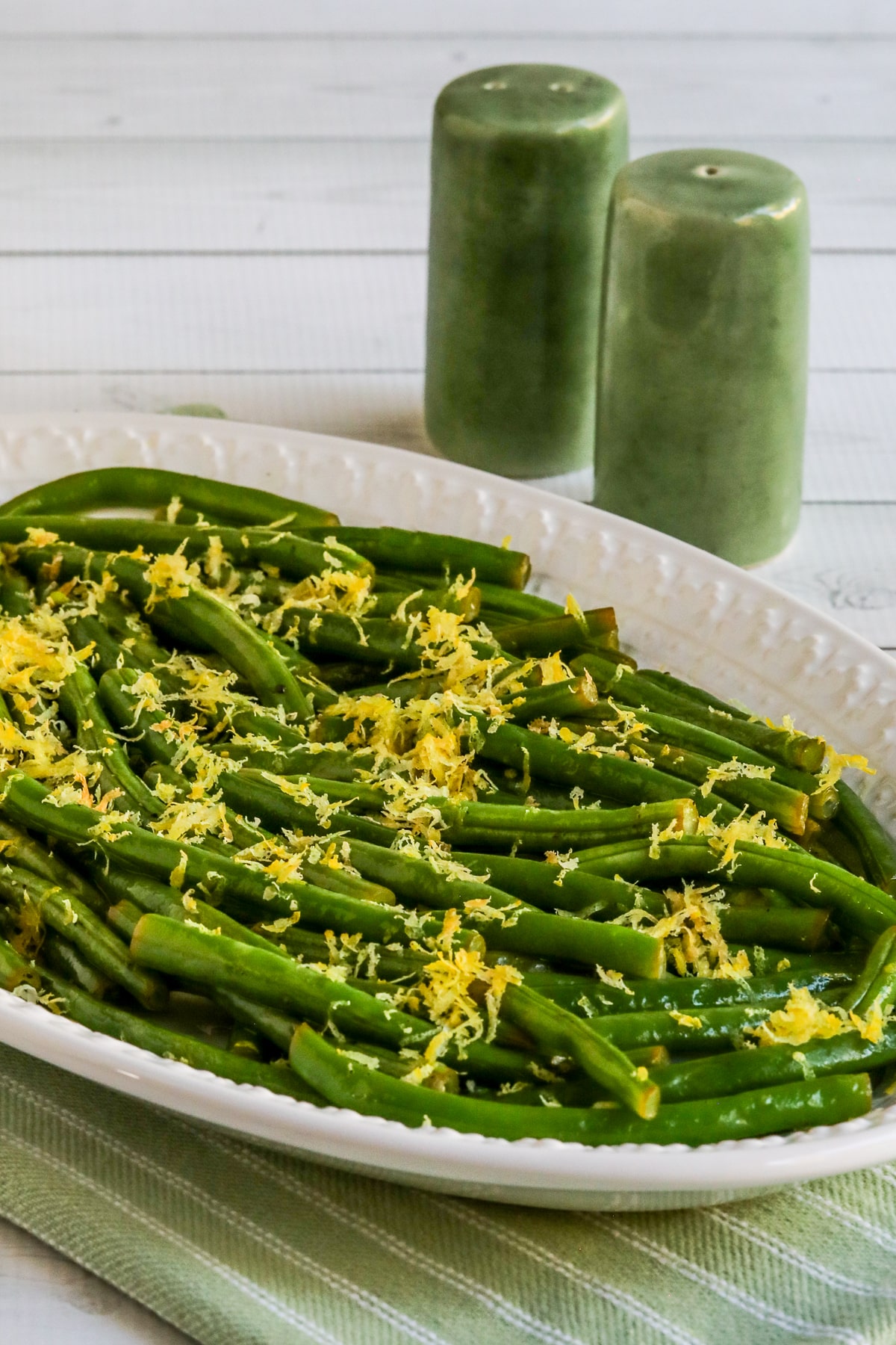 Lemon Green Beans on serving plate, with lemon zest.