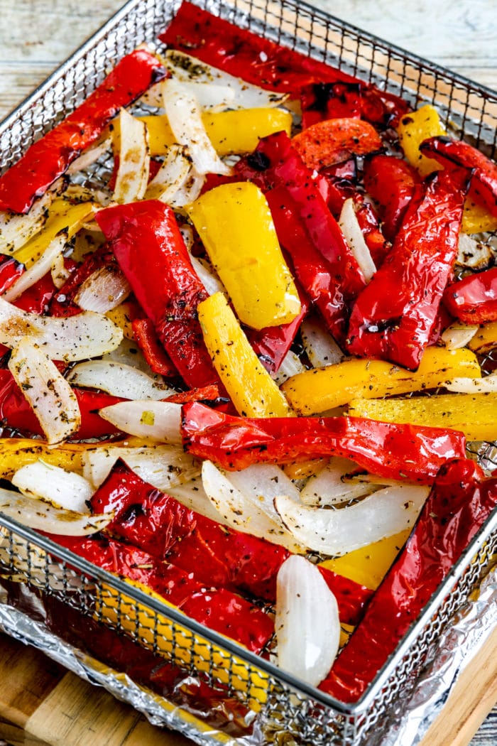 Air Fryer Peppers and Onions close up photo of cooked peppers and onions in air fryer basket