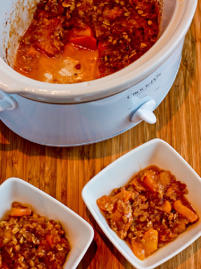 Slow Cooker Peach Crisp in slow cooker and in two bowls