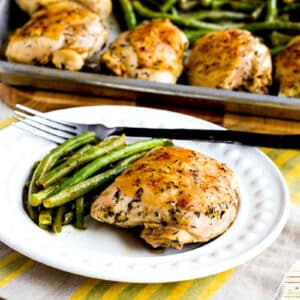 square image of Chicken and green beans sheet pan meal with one serving on plate and sheet pan in background