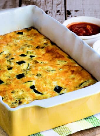 Square image of Zucchini Breakfast Casserole with Green Chiles in baking dish.