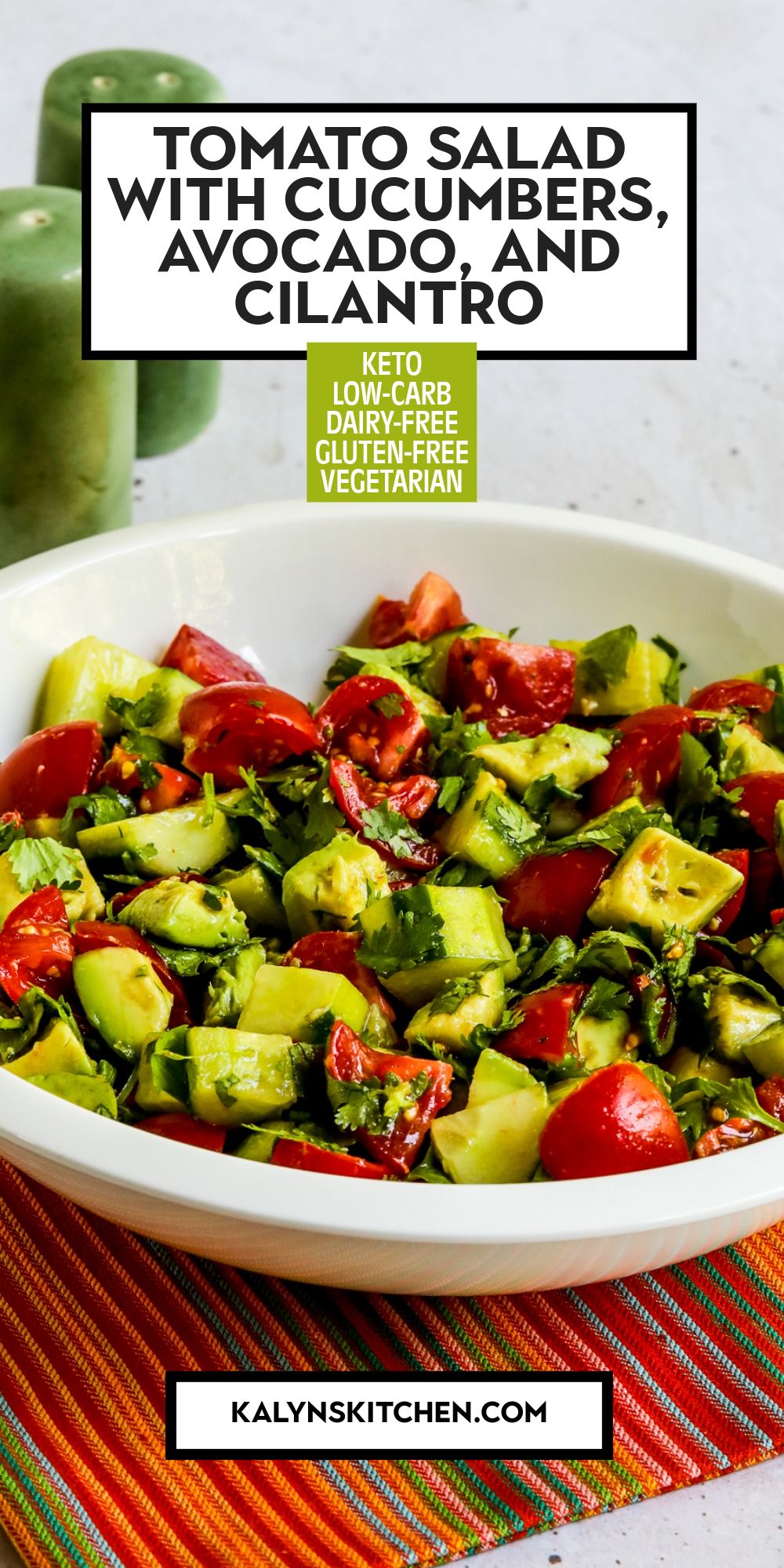 Pinterest image of Tomato Salad with Cucumbers, Avocado, and Cilantro shown in white bowl.