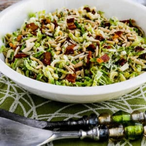 square image for Brussels Sprouts Salad with Bacon, Almonds, and Parmesan shown in serving dish