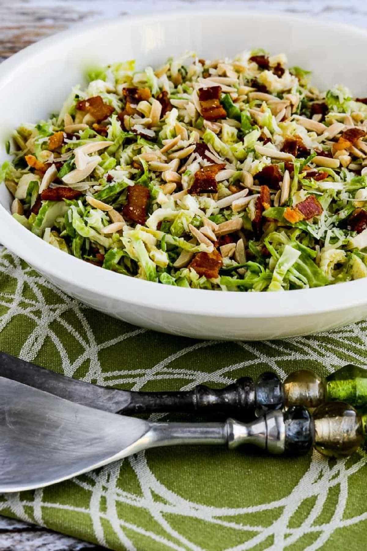 Brussels Sprouts Salad with Bacon, Almonds, and Parmesan in serving bowl