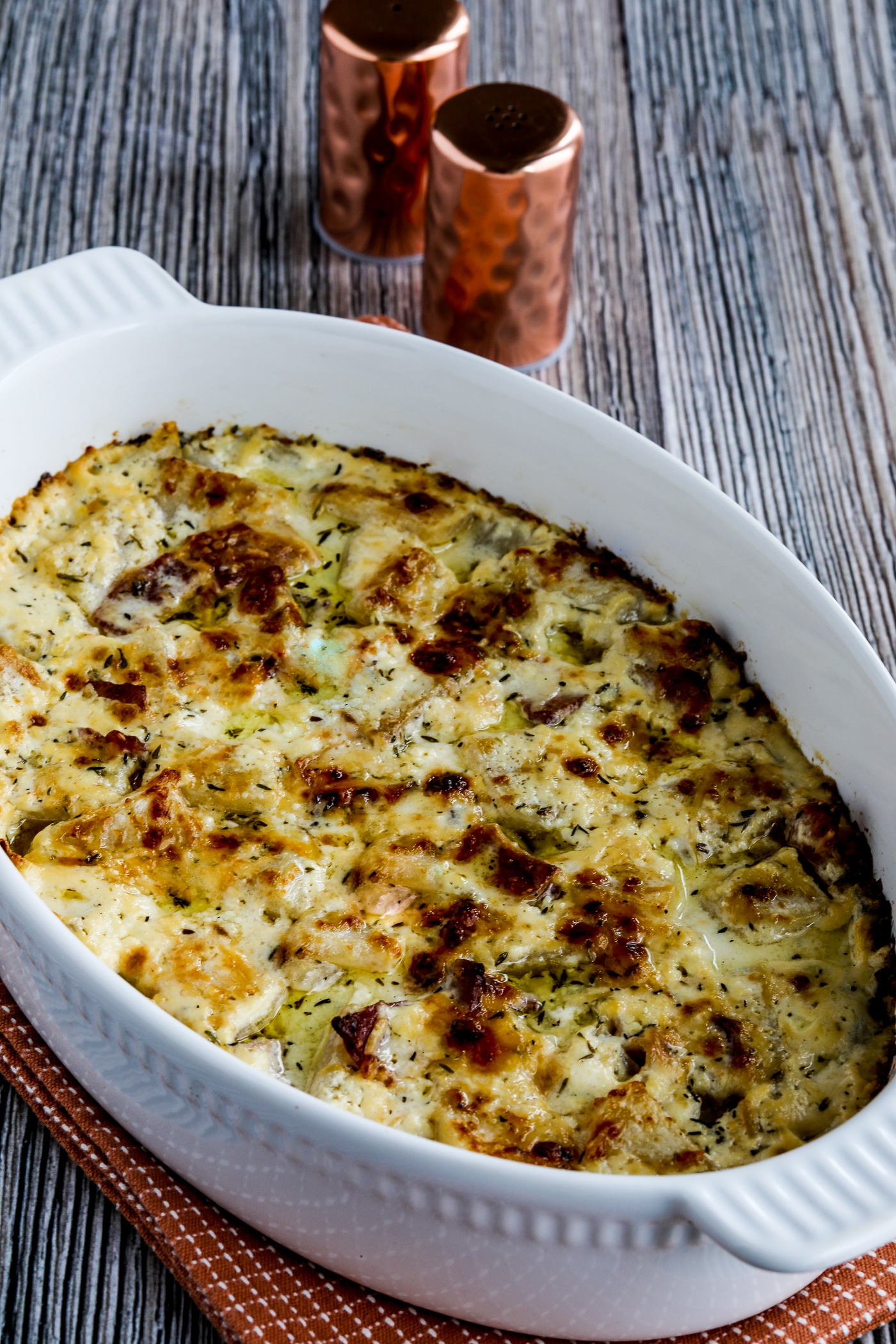 close-up photo of Turnip Gratin with Bacon shown in baking dish