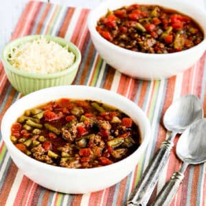 Square image for Instant Pot Soup with Ground Beef, Green Beans, and Tomatoes shown on napkin with spoons and Parmesan.