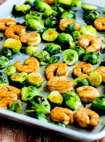 square image for Roasted Asian Shrimp and Brussels Sprouts Sheet Pan Meal shown on sheet pan.