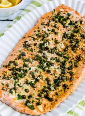 close-up photo of Slow Cooked Salmon with Butter, garlic, capers, and Lemon on serving plate