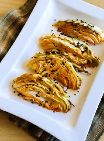 Spicy Baked Cabbage on serving dish with black sesame seeds