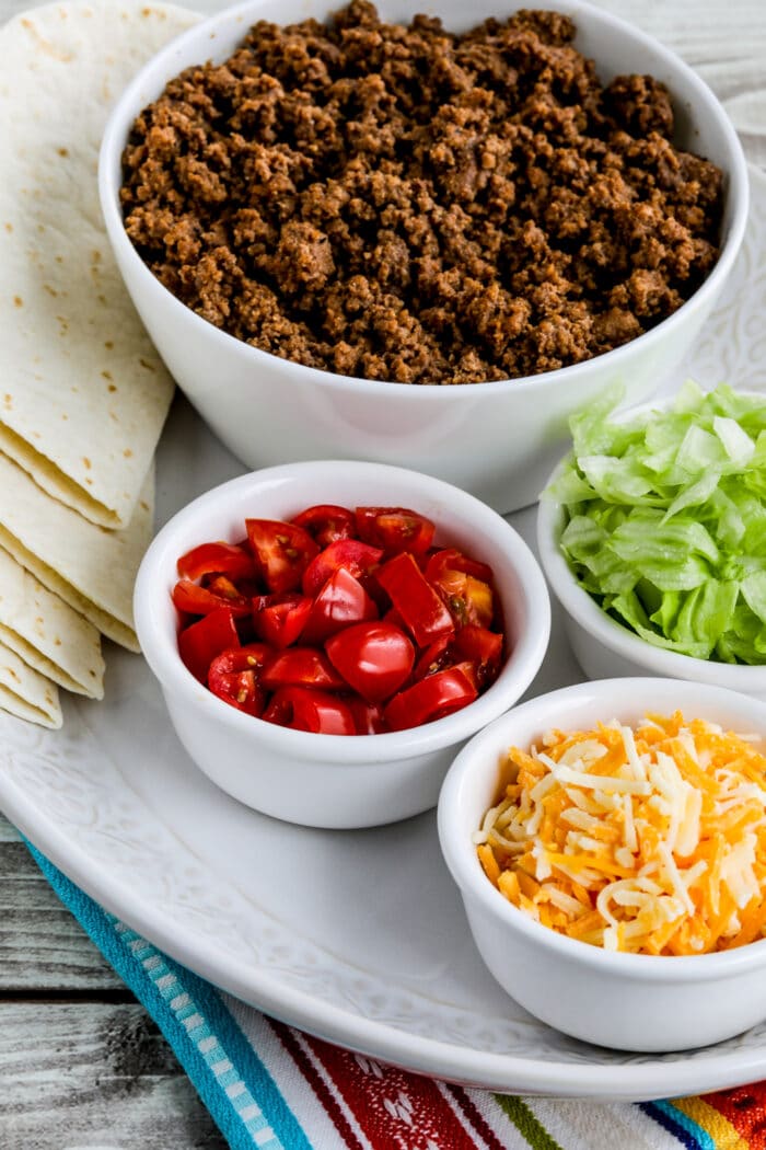 close-up photo of Instant Pot Taco Meat with tortillas and taco fixings