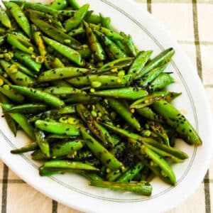Square image for Spicy Stir-Fried Sugar Snap Peas showing them on serving plate.