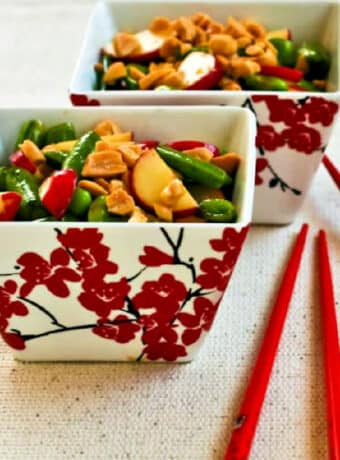 Sugar Snap Pea Salad shown in two serving dishes with chopsticks.