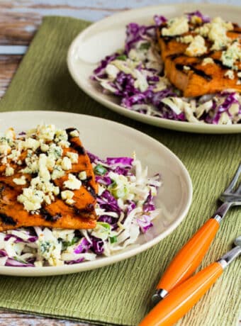 Buffalo Salmon with Blue Cheese Slaw shown on two serving plates.