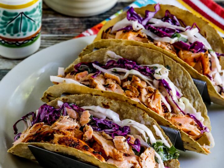 Healthy salmon tacos topped with fresh cabbage slaw, delicious weight loss recipe