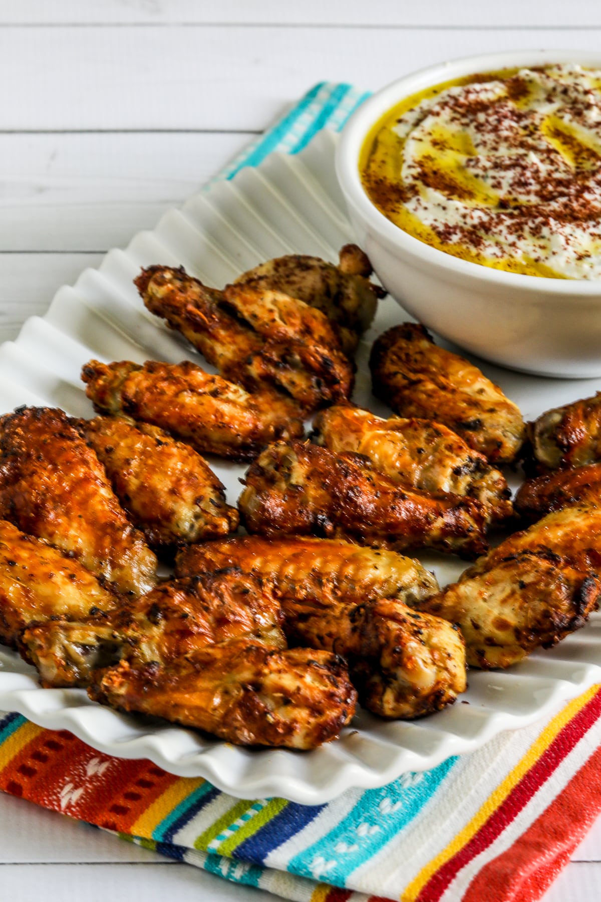 Greek Air Fryer Chicken Wings on serving platter with Feta dip