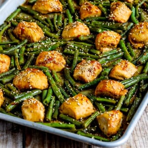 Square image of Asian Chicken and Green Beans shown on sheet pan.