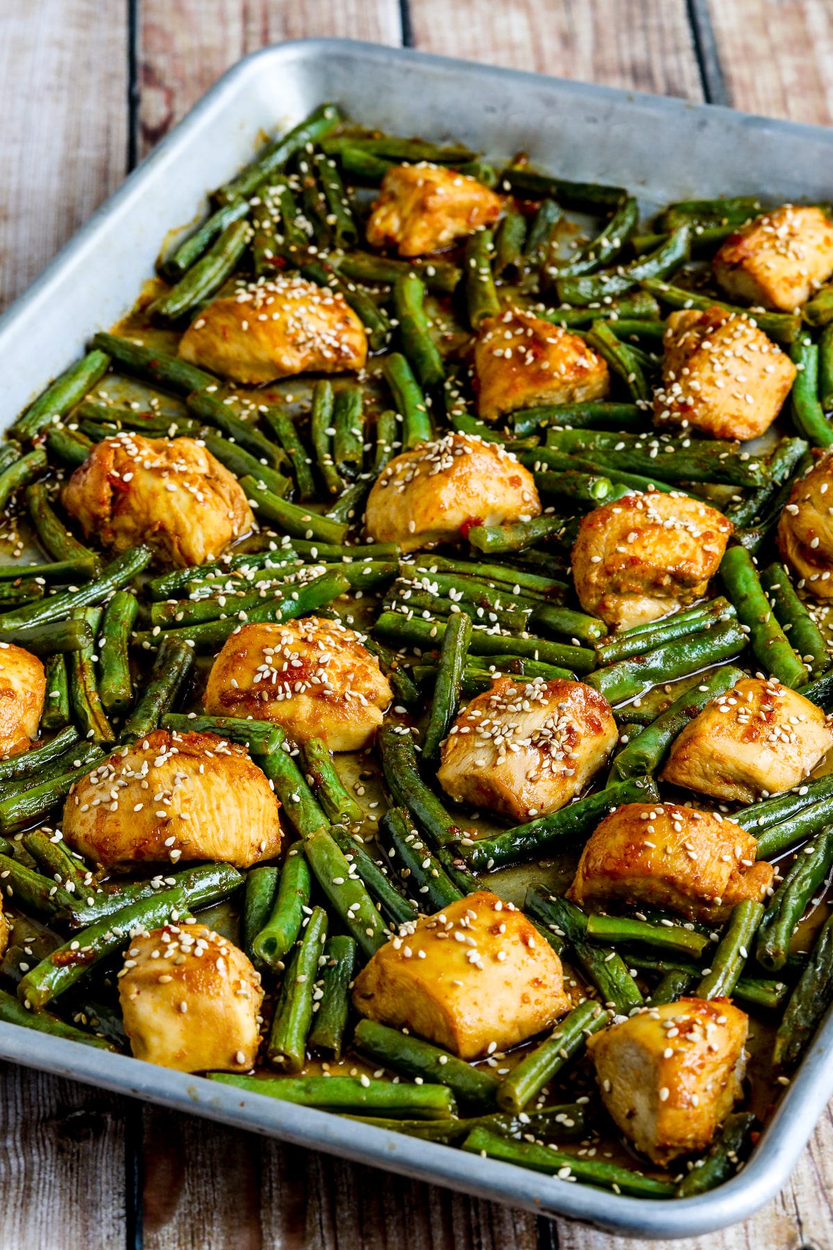 Asian Chicken and Green Beans Sheet Pan Meal Shown in Sheet Pan in Second Photo.