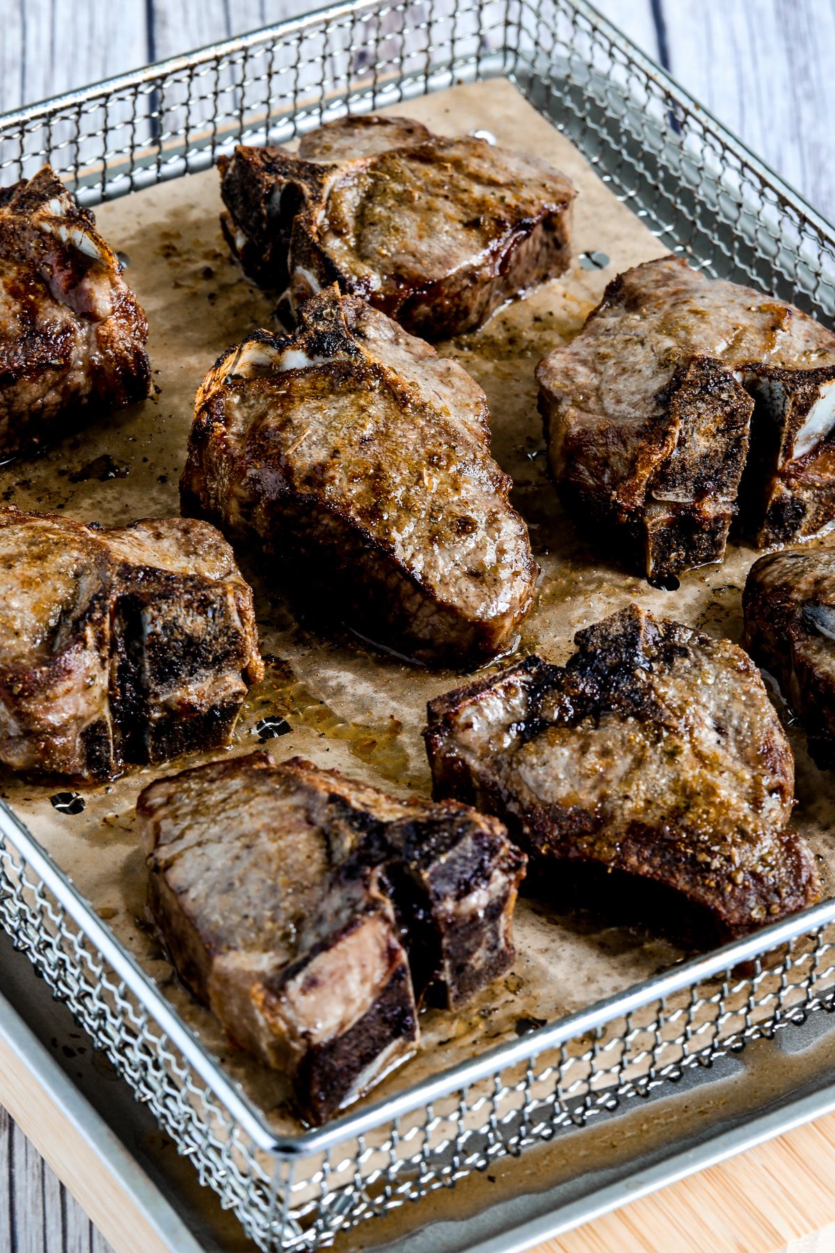 Lamb Chops shown in Air Fryer basket.