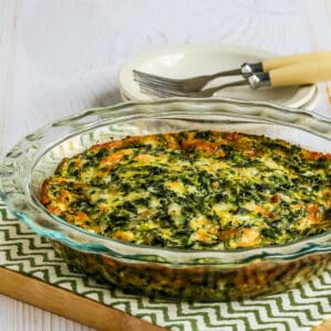 Square image of Crustless Spinach Quiche in baking dish.