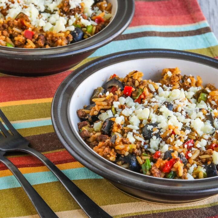 Beef Taco Bowls shown in two bowls with Cotija cheese.