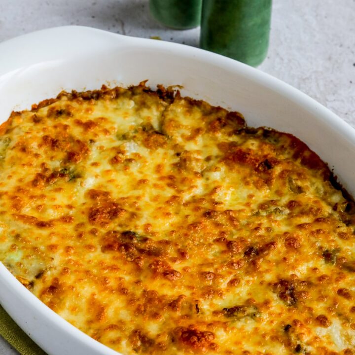 Cabbage Gratin side dish shown in baking dish with salt-pepper shakers.
