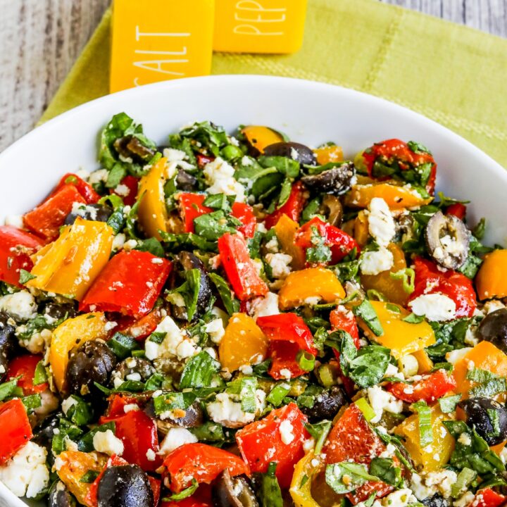 Roasted Pepper Salad shown in salad bowl with salt-pepper shakers in back.