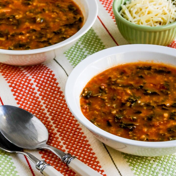 Less close-up photo of Tomato Spinach Soup in two bowls.