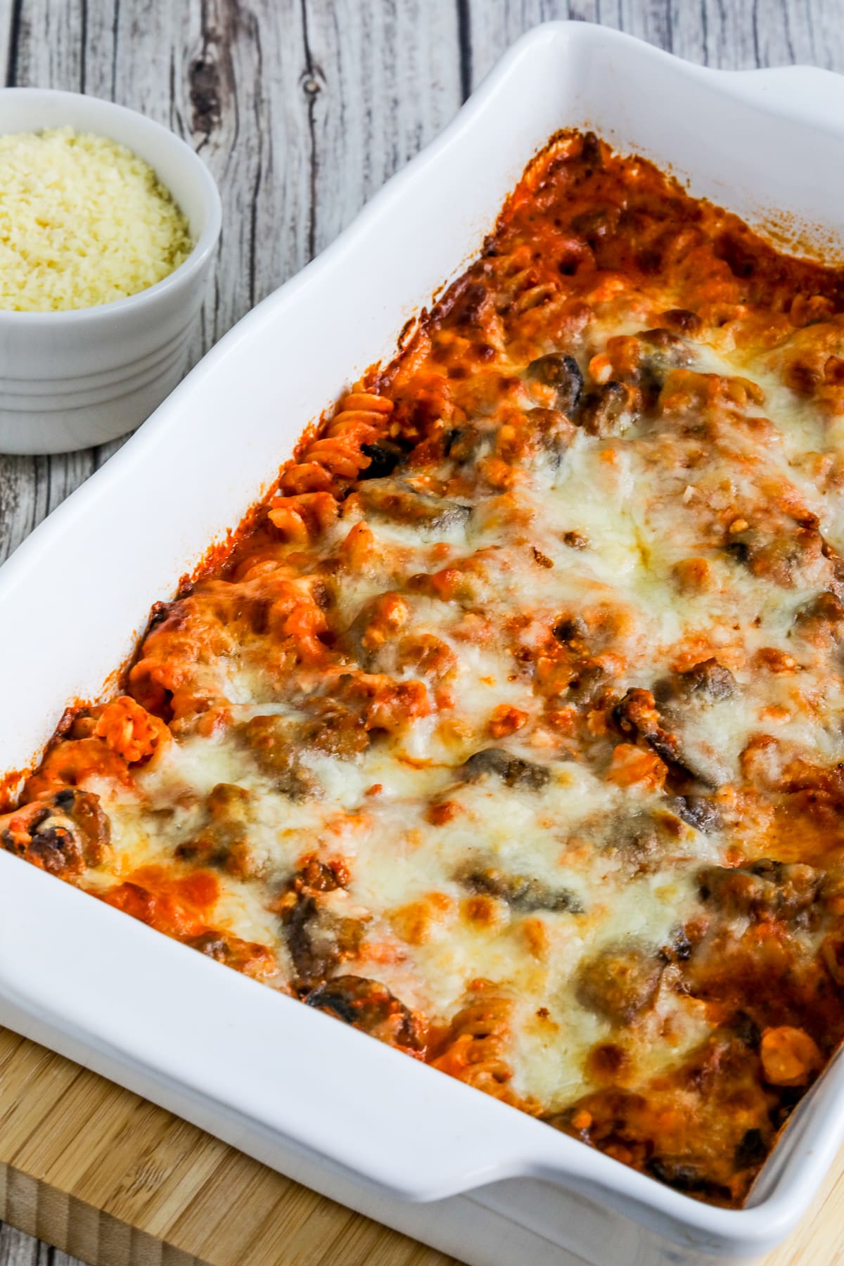Cottage Cheese Pasta Bake with Mushrooms close-up photo in baking dish.