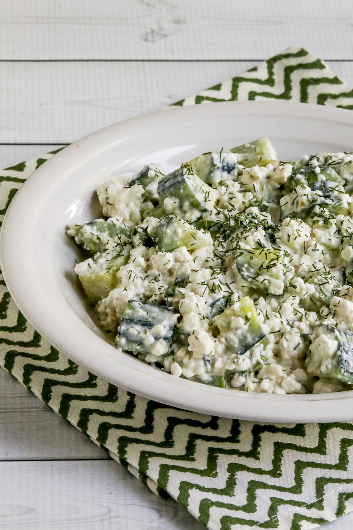 Slightly cropped view of Cottage Cheese Cucumber Salad in serving bowl.